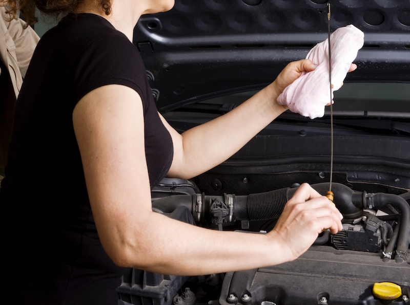 Check oil with dipstick