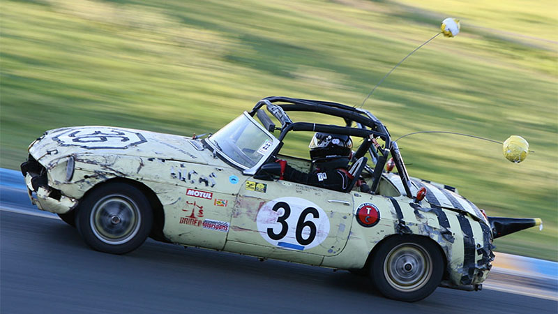 a car modded to look like a bumble bee on a 24 Hours of Lemons course