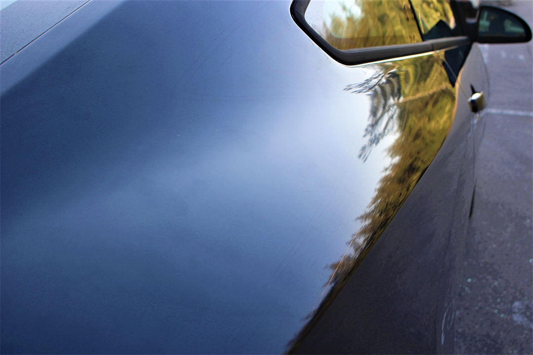 side view of a black vehicle after using the 303 Graphene Nano Spray