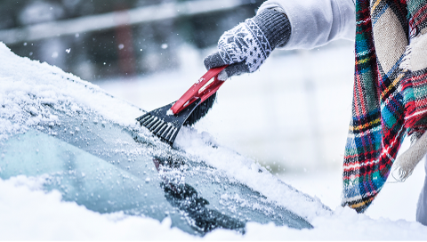 Scraping ice off windshield