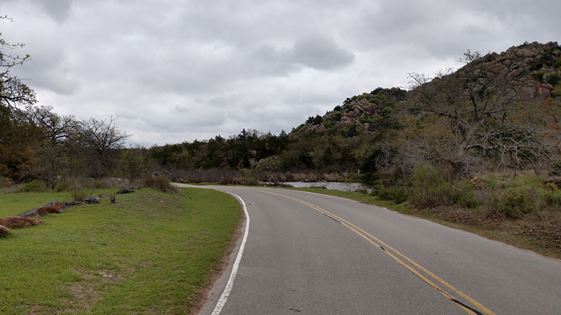 curving road with rocky hills