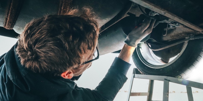 Mechanic under car