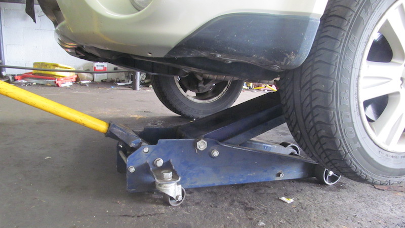 Using jack to raise car up