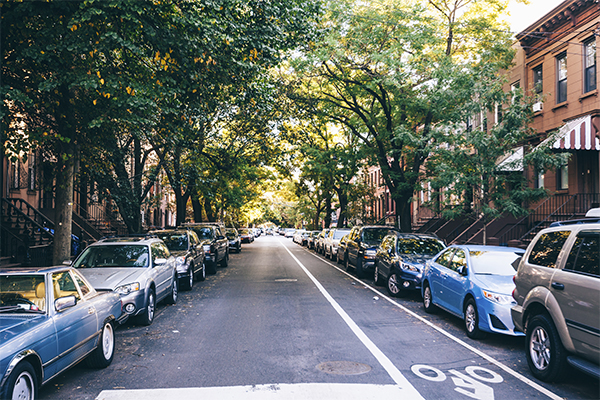 street lined with parked cars