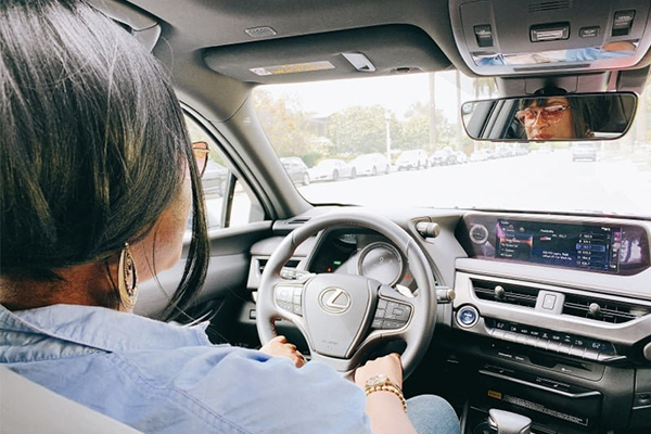 woman driving a Lexus