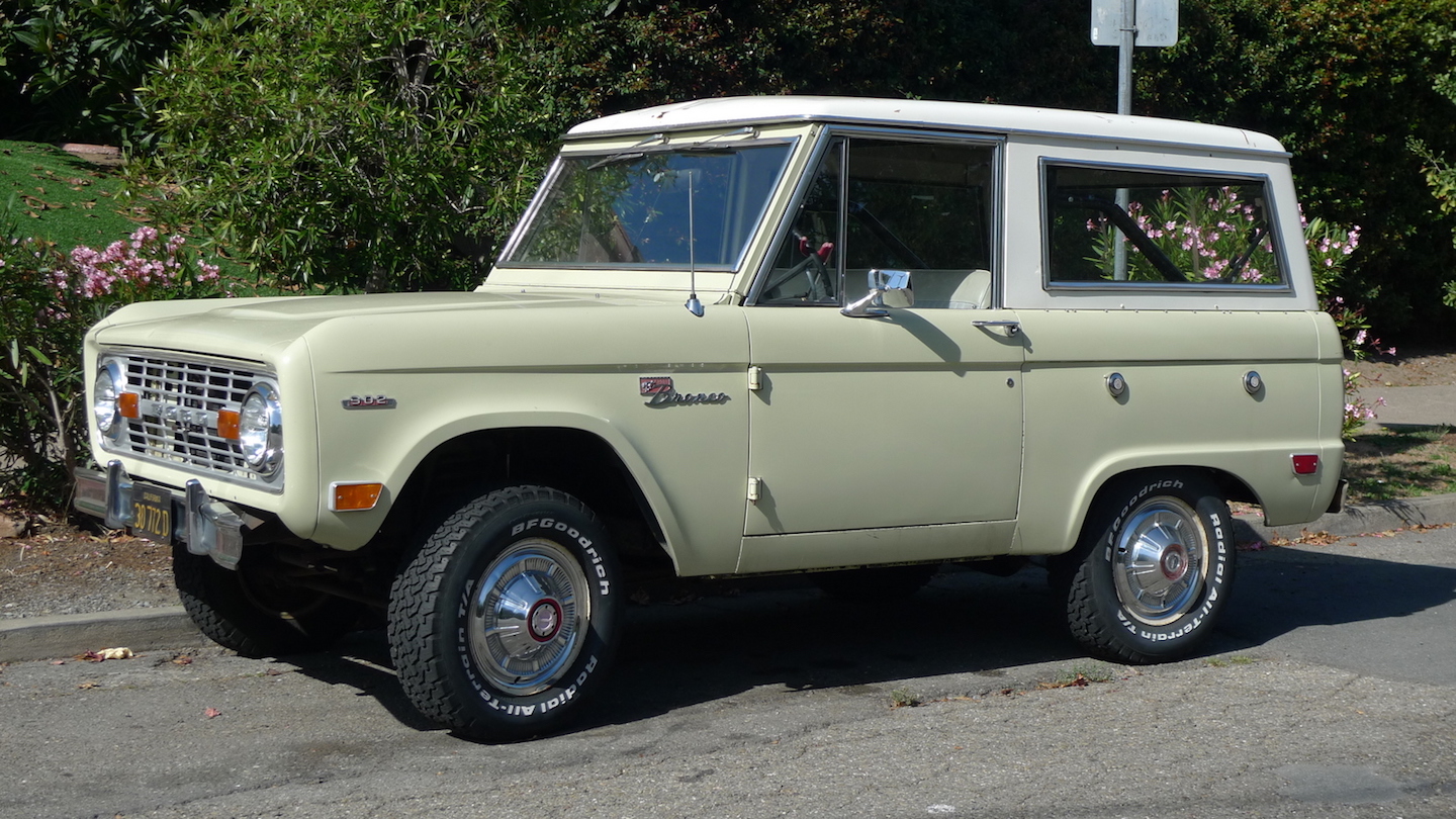 Cream colored classic Ford Bronco