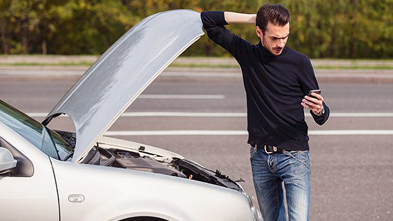 Car broken down on the side of the road.