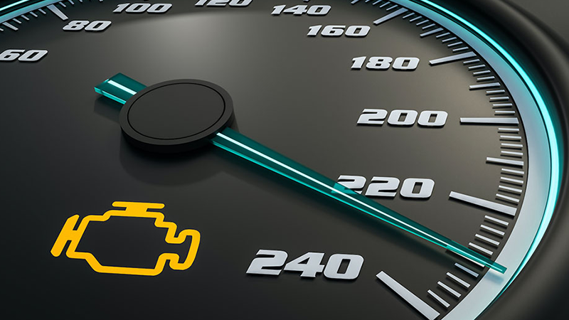 A bright yellow check engine light is on a black and blue dashboard.