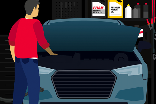 person looks under hood of car