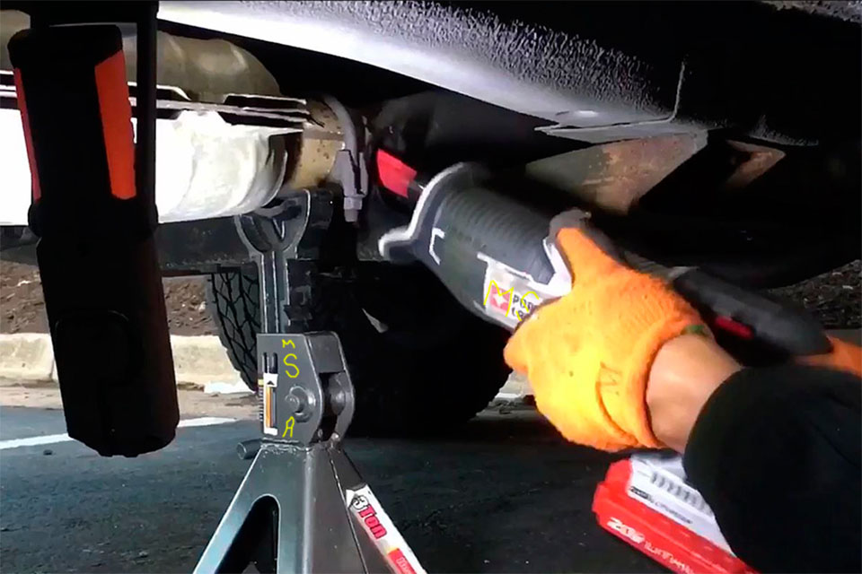 cutting out old catalytic converter