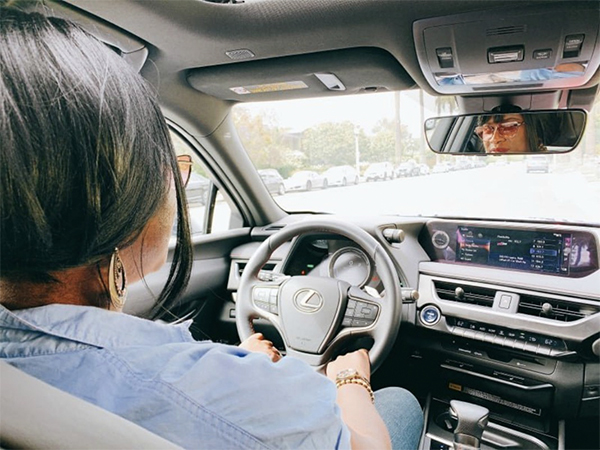 woman driving a Lexus