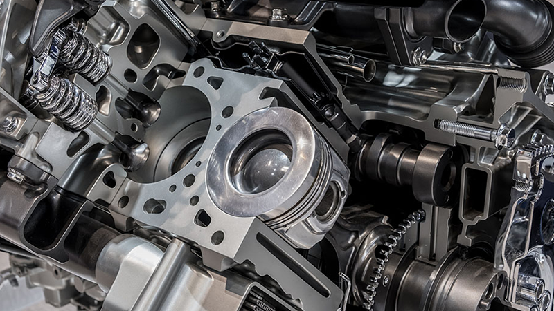 Shiny engine parts on display.