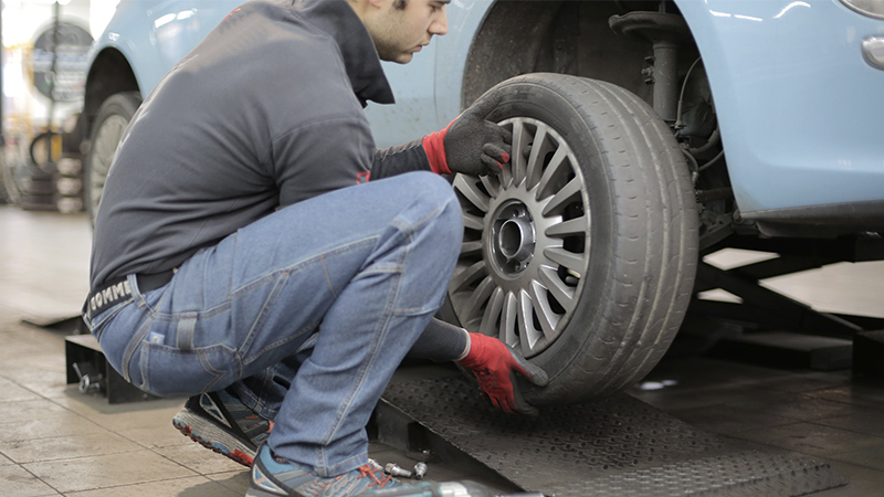 man removing a wheel