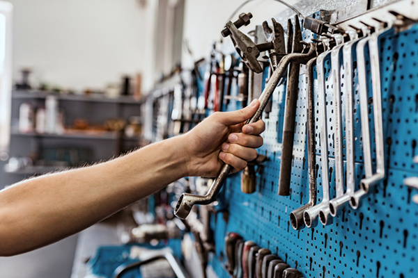 person grabbing tools