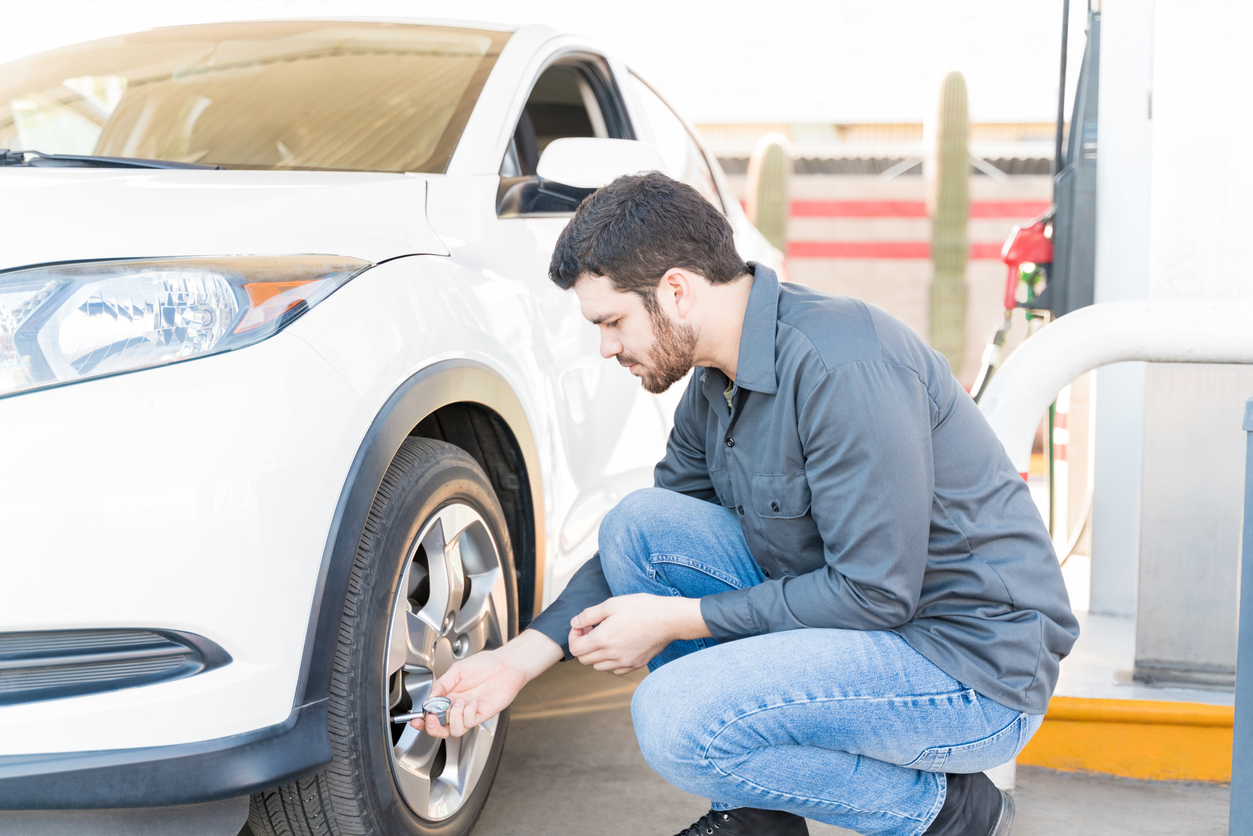Mechanic checking tire