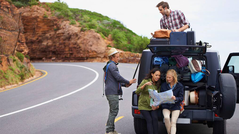 four people planning for a trip