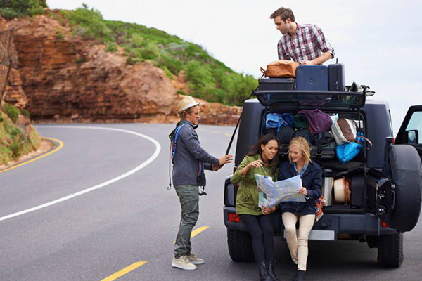 four people planning for a trip