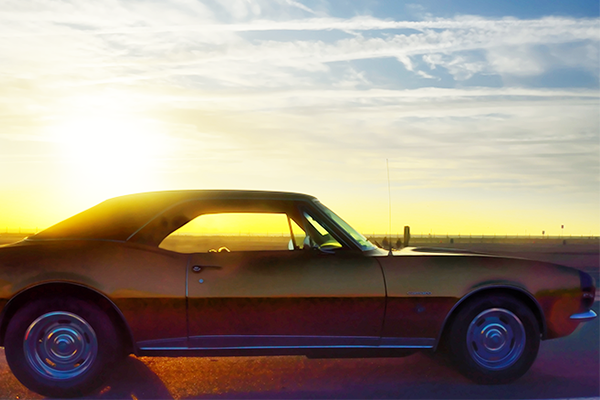 vintage camaro in sunset
