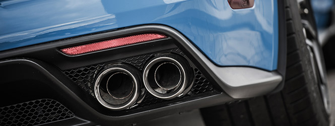 Picture of a cars tail pipe.